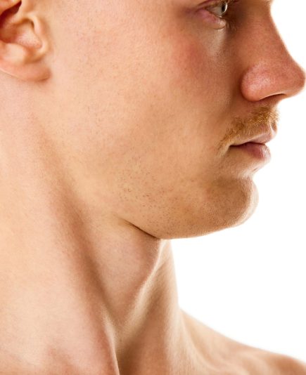 Double chin problem. Cropped side view portrait of young man with mustache against white studio background. Concept of natural beauty, selfcare treatment, body and skincare, hygiene, fashion. Ad