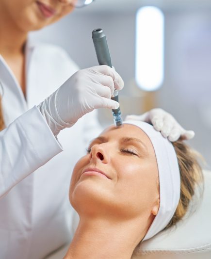 Woman in a beauty salon having needle mesotherapy treatment. High quality photo